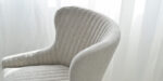 dining chair in light beige upholstery and black legs